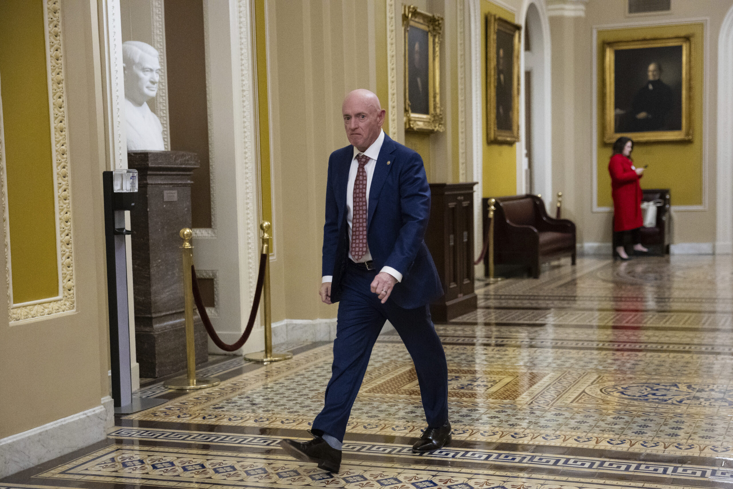 Sen. Mark Kelly (D-Ariz.) walks to a vote at the U.S. Capitol Feb. 26, 2025.