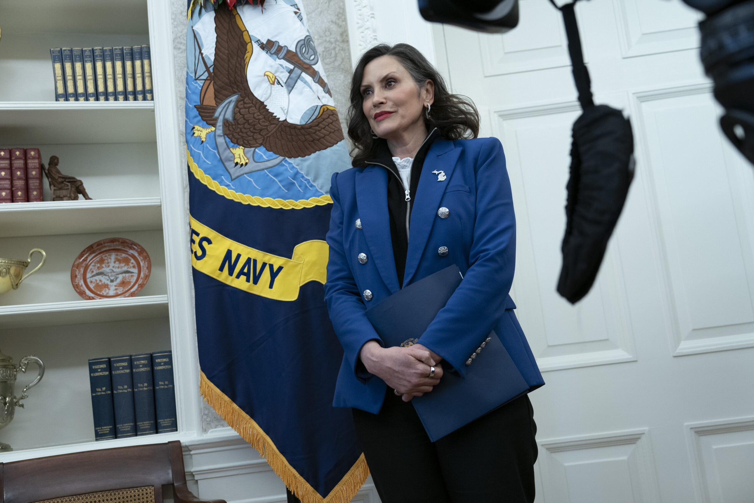 Michigan Gov. Gretchen Whitmer looks on as President Donald Trump signs executive orders at the White House in Washington, on April 9, 2025.