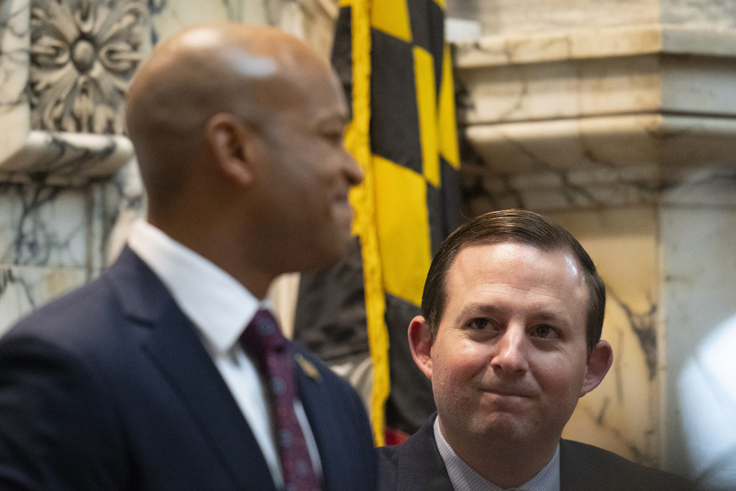 Maryland Senate President Bill Ferguson, D-Baltimore (right) looks at Gov. Wes Moore during Moore's first state of the state address, two weeks after being sworn as governor, Feb. 1, 2023, in Annapolis, Maryland.